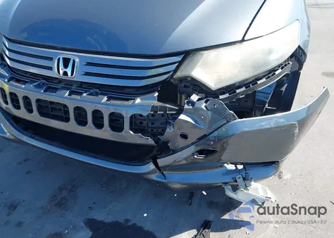 2011 Honda Insight from USA, damaged, VIN JHMZE2H32BS003362